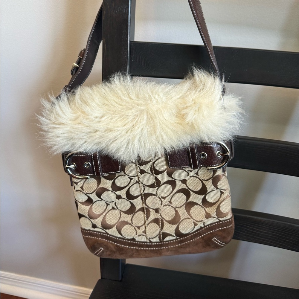 Barely used coach handbag with fur trim